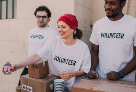 Recognizing Volunteers - Three People Donating Goods