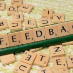 Negative Feedback - The word feedback is spelled out with scrabble tiles