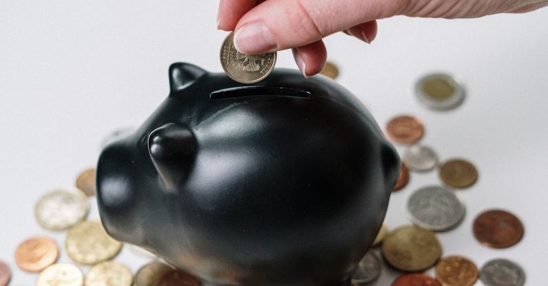 Donor-Advised Funds - Person Putting Coin in a Piggy Bank