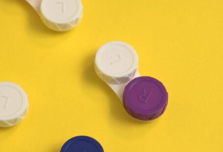 Philanthropy Cases - Colourful lens containers on a yellow background