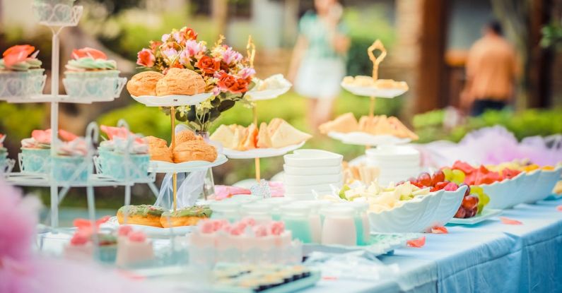 Fundraising Events - Various Desserts on a Table covered with Baby Blue Cover