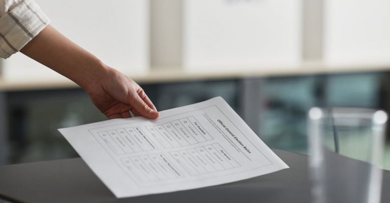 Social Responsibility - A Person Holding a Voting Ballot Paper